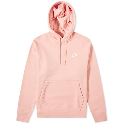 peach colored nike sweatshirt.